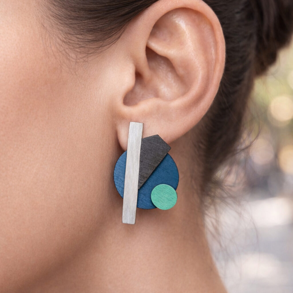 Turquoise and mint Bauhaus earrings worn on ear – first design
