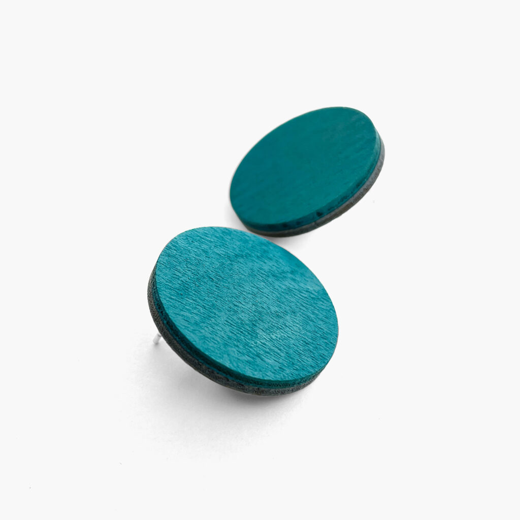 Large petrol round stud earrings – angled side view