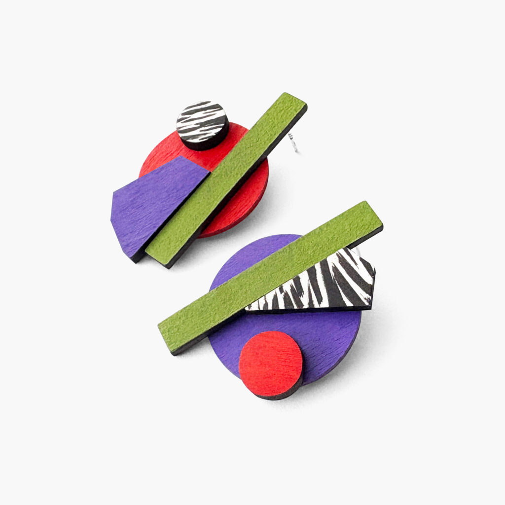 Mismatched wooden statement earrings on a white background