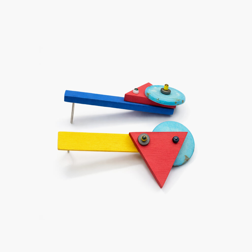Colorful geometric earrings showing side profile and layered details