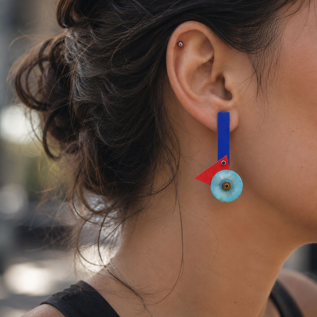Colorful geometric statement earring worn on ear