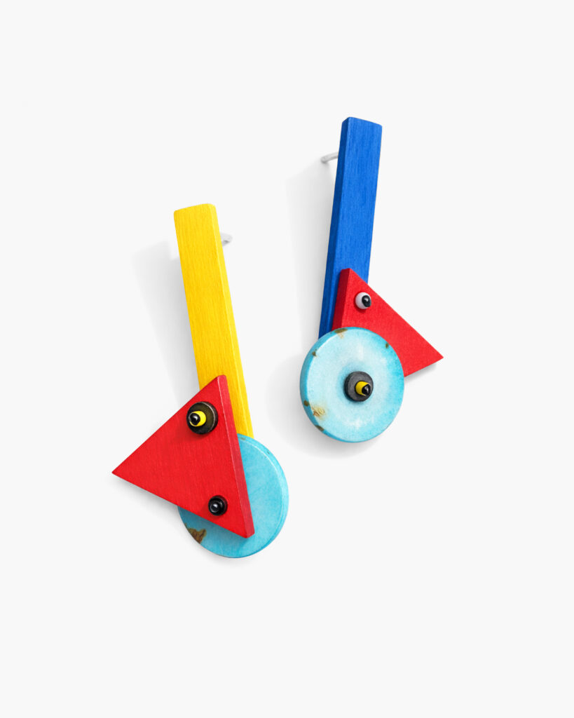 Asymmetrical geometric wooden earrings with red yellow and blue details