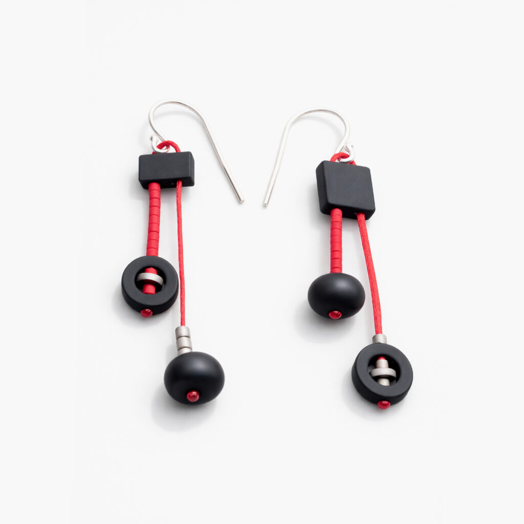 Black and red mismatched statement earrings with round and square beads