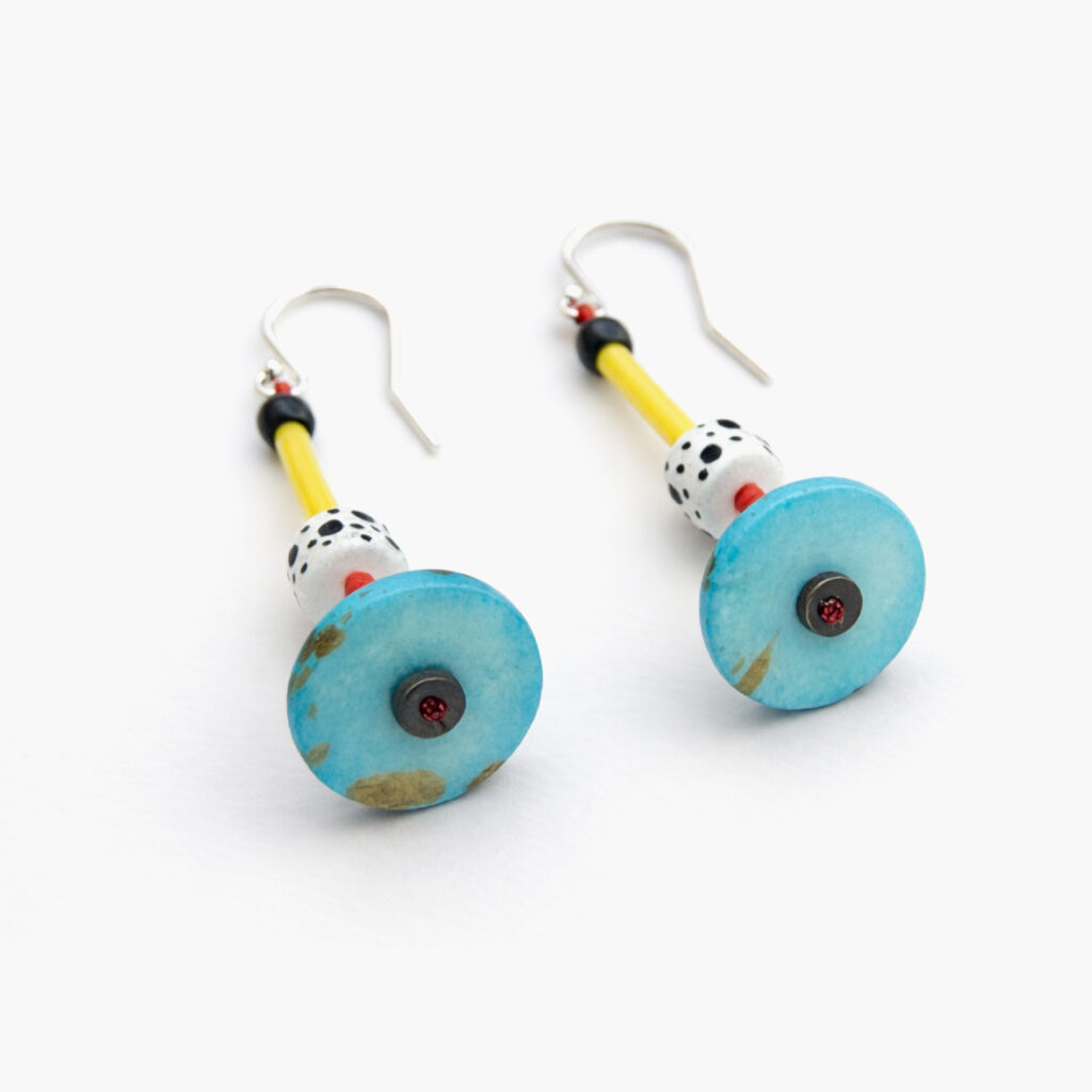 Turquoise circular wooden dangle earrings with colorful geometric bead details