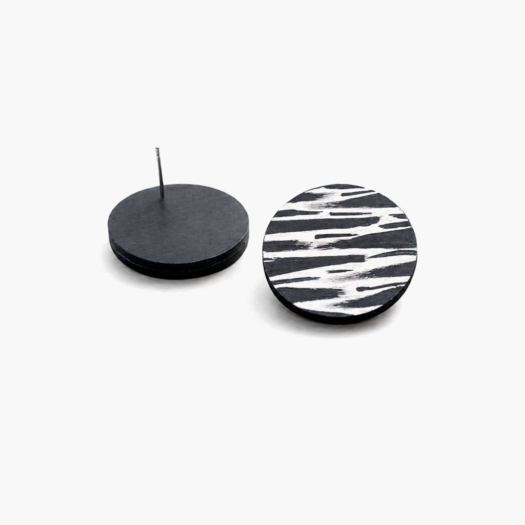 Black and white zebra pattern wooden stud earrings showing front and back
